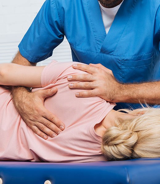chiropractor-with-patient Balfour Health Center Chiropractic Care in Northridge